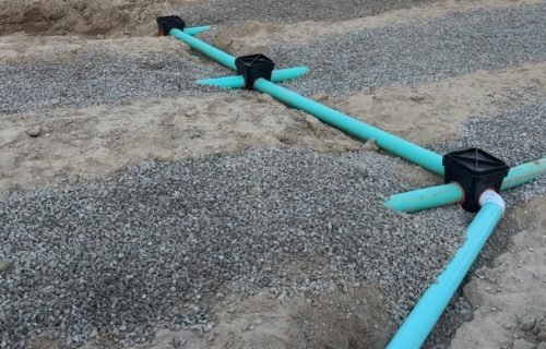 Septic drainage pipe system being installed underground