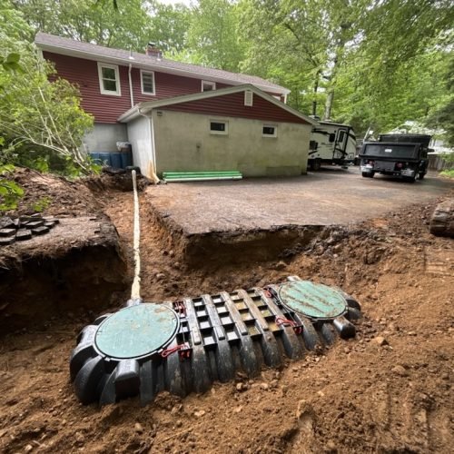Advanced septic treatment system installed in excavation trench